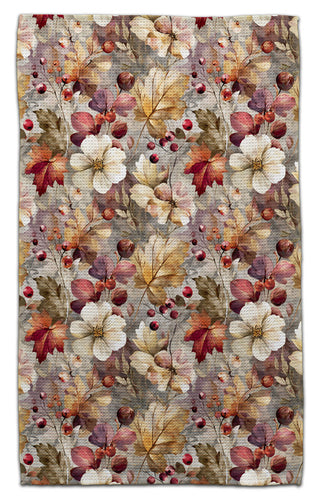 Floral and leaf patterned echo-friendly towel with autumn colors on a textured background