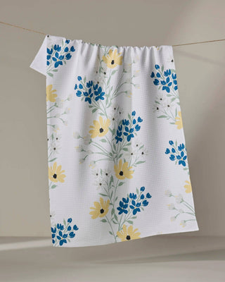 Geometry Garden Picks floral kitchen tea towel featuring blue blossoms and yellow flowers on white Geoweave™ fabric
