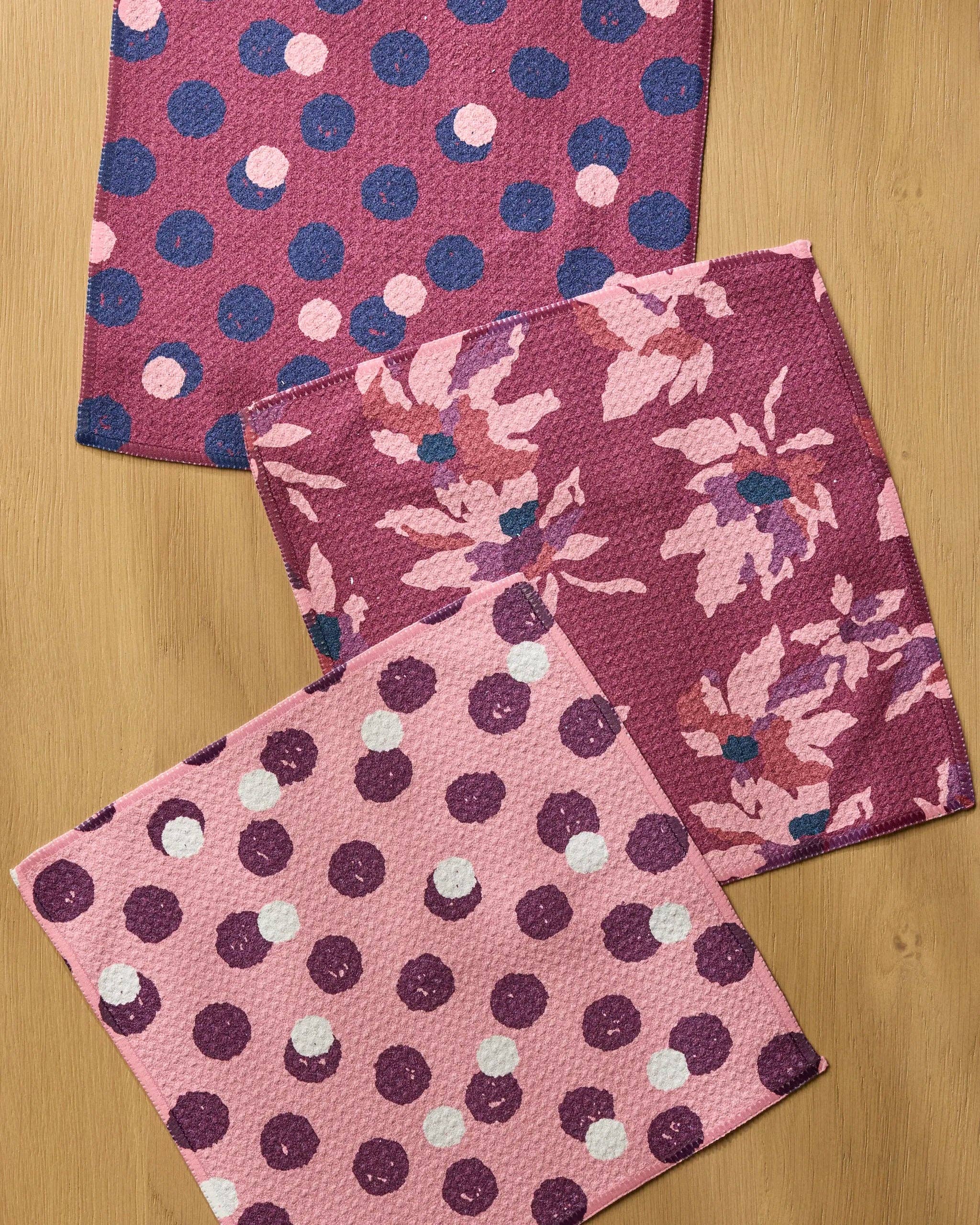 Close-up of Geometry Mulberry Bloom Dot Dishcloth Set showing Geoweave texture with three coordinating mulberry, floral, and pink polka dot eco-friendly dishcloths