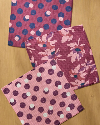 Close-up of Geometry Mulberry Bloom Dot Dishcloth Set showing Geoweave texture with three coordinating mulberry, floral, and pink polka dot eco-friendly dishcloths