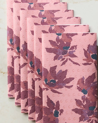 Close-up of Geometry Mulberry Bloom Not Paper Towel set of 6 showing embossed Geometry G logo pattern on blush pink reusable paper towel with mulberry floral print