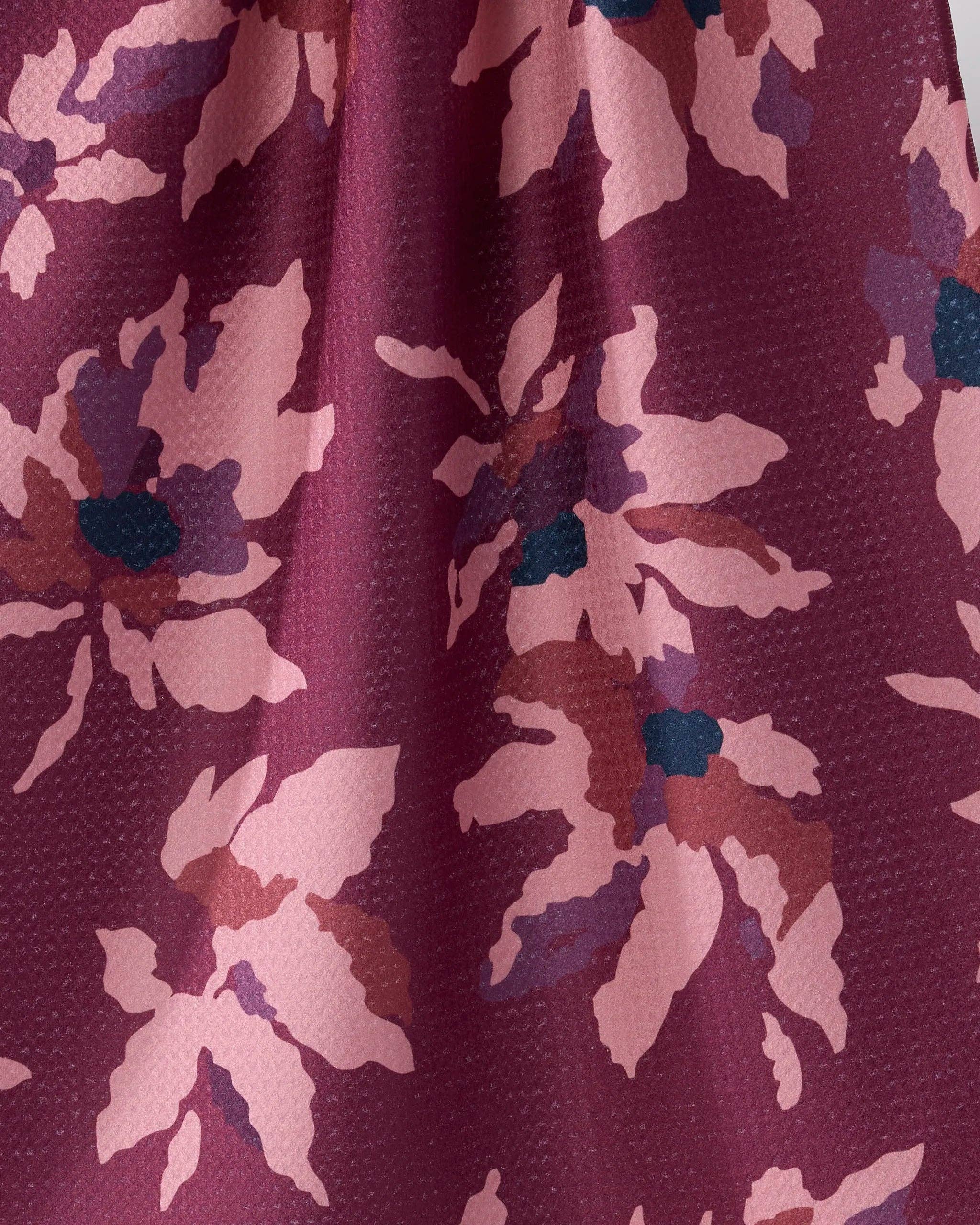 Close-up of Geometry Mulberry Bloom Tea Towel showing Geoweave™ texture with painterly blush pink and teal floral pattern on rich mulberry recycled polyester fabric