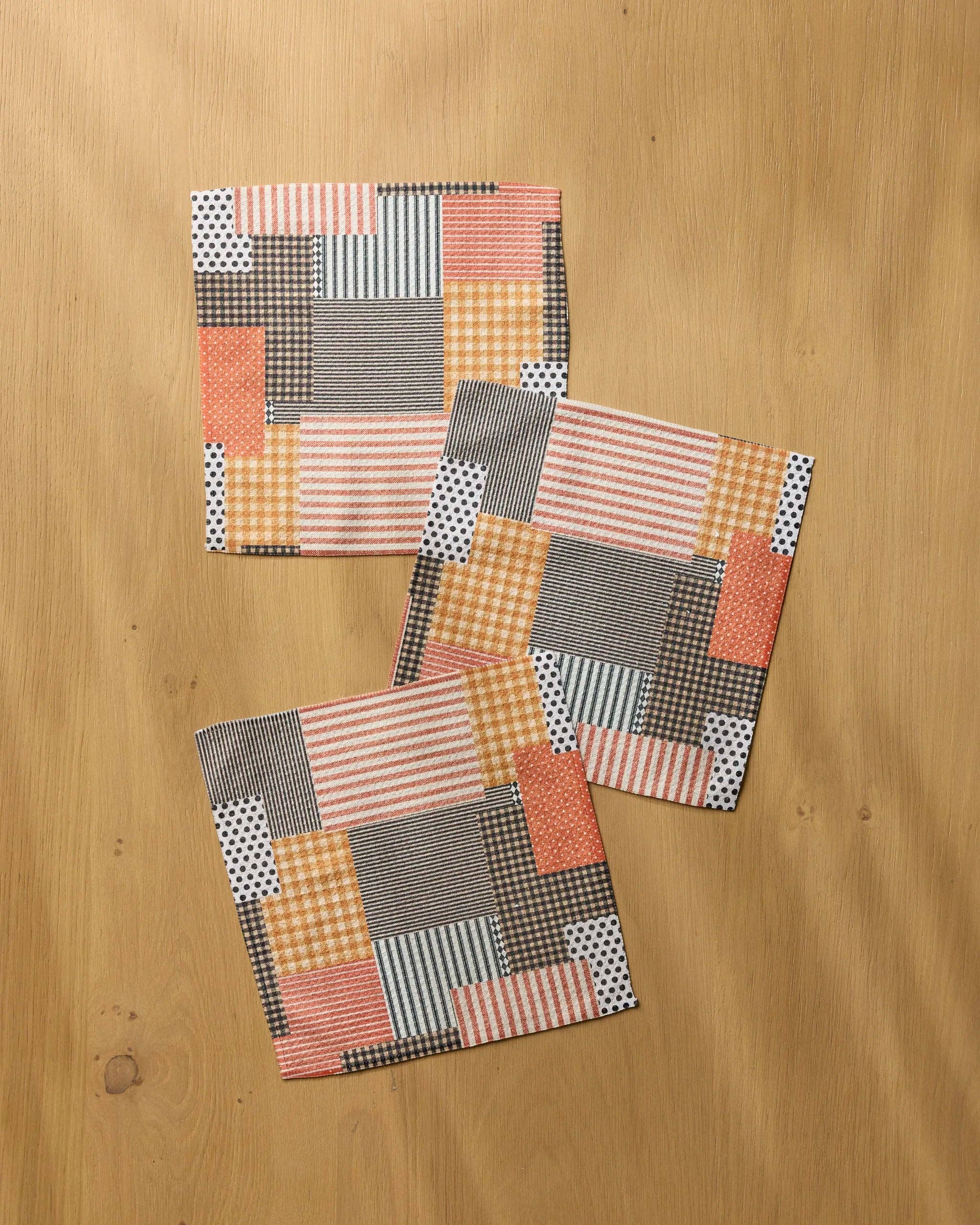 Geometry Patch and Pumpkin Dishcloth Set 3-pack — autumn patchwork Geoweave™ dishcloths with orange, brown, beige, and white stripes, polka dots, and gingham, 10x10 inches each
