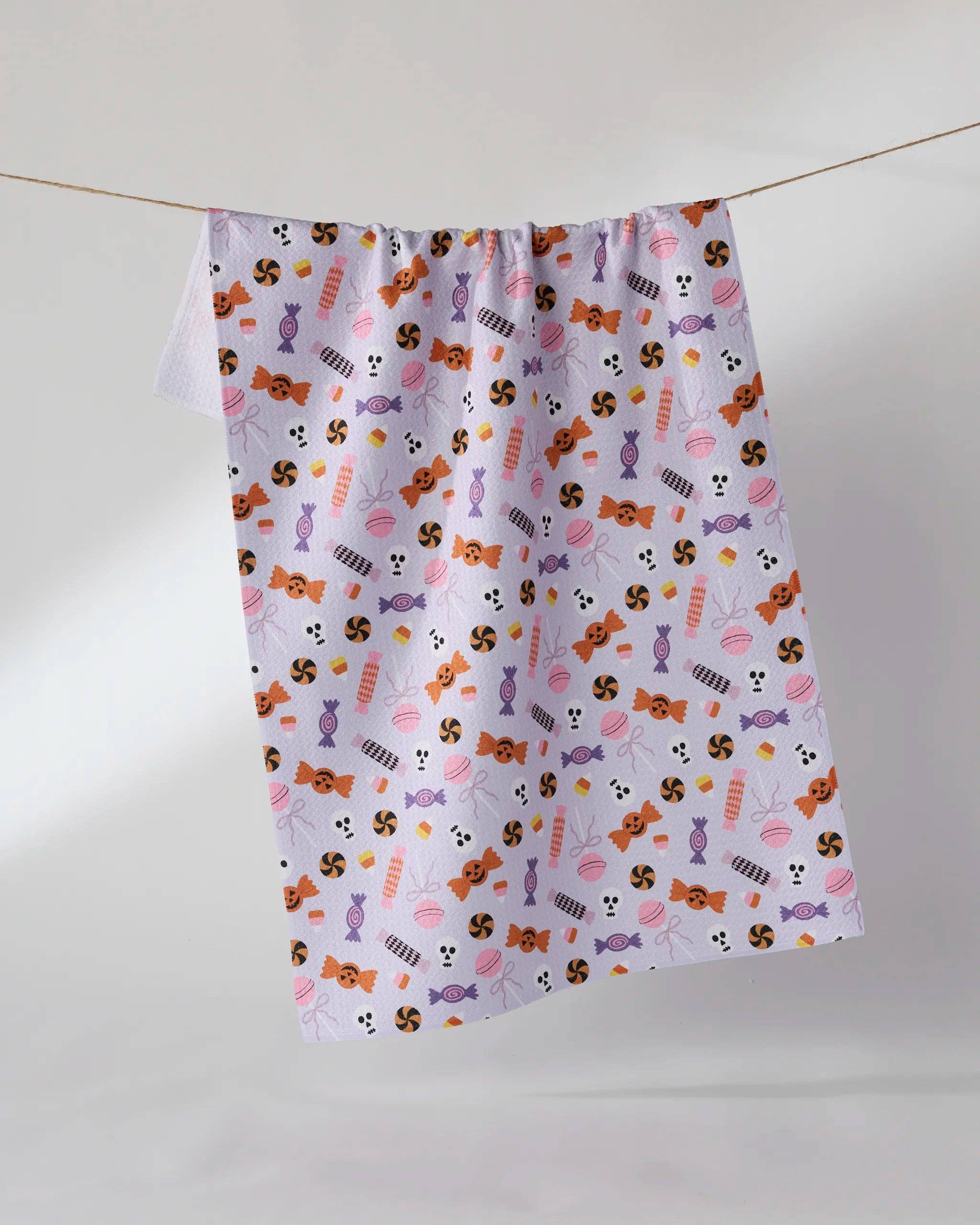Geometry Spooky Sweets Halloween Tea Towel — purple Geoweave™ kitchen towel with Halloween candy and sweets print, 18x30 inches, made from recycled materials
