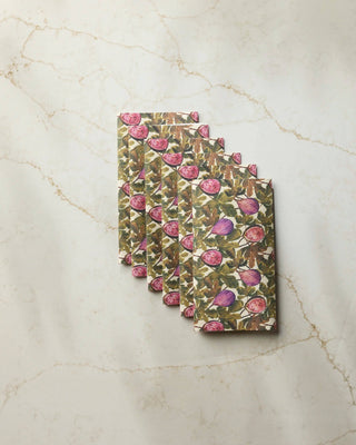 Geometry Wild Fig Not Paper Towel set of 6 fanned out on white marble surface showing botanical print of purple whole figs, pink sliced figs, and green fig leaves on cream recycled paper towel