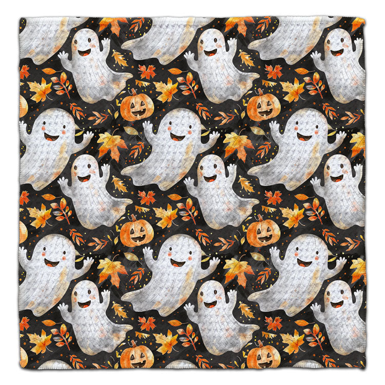 Halloween washcloth featuring smiling ghosts, pumpkins and colorful autumn leaves on a black background