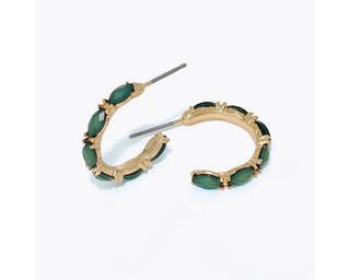 Gold hoop earrings with a full row of prong-set marquise-cut faceted deep green stones by Periwinkle — emerald-inspired jewel-tone hoops for a bold,
