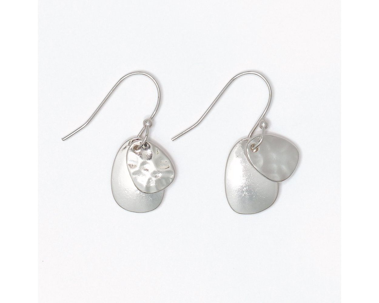 Hammered and polished silver layered disc drop earrings with a smaller hammered top disc and larger smooth brushed bottom disc by Periwinkle
