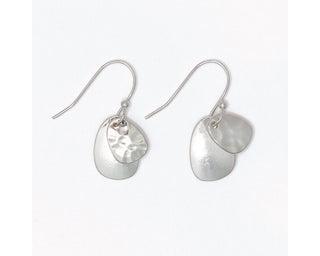 Hammered and polished silver layered disc drop earrings with a smaller hammered top disc and larger smooth brushed bottom disc by Periwinkle
