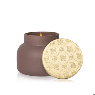 Matte brown 19 oz Havana Vanilla signature candle with an embossed gold lid, designed for elegant home décor and cozy home fragrance.