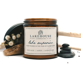 Lakehouse Candle Co. candle with label and natural elements on a white background