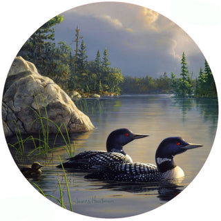 Loon design silicone jar opener featuring a pair of loons swimming on a peaceful northern lake surrounded by pine trees