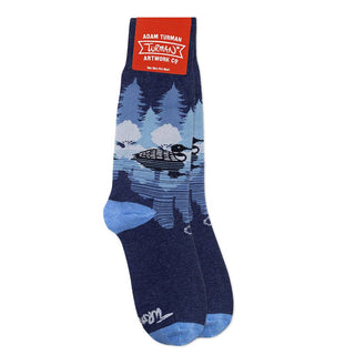 Midnight Loon crew socks by Adam Turman featuring a loon gliding across a moonlit lake with pine trees reflected in deep blue waters.
