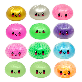 Set of colorful, smiley-faced dumplings in various colors on a white background