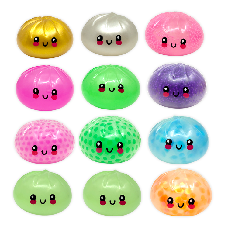 Set of colorful, smiley-faced dumplings in various colors on a white background