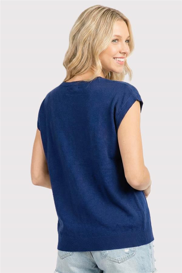 woman wearing navy short sleeve sweater with embroidered stars on front-back