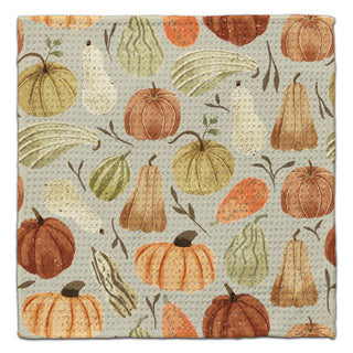 Oh My Gourd towel with pumpkins and gourds design on a beige background