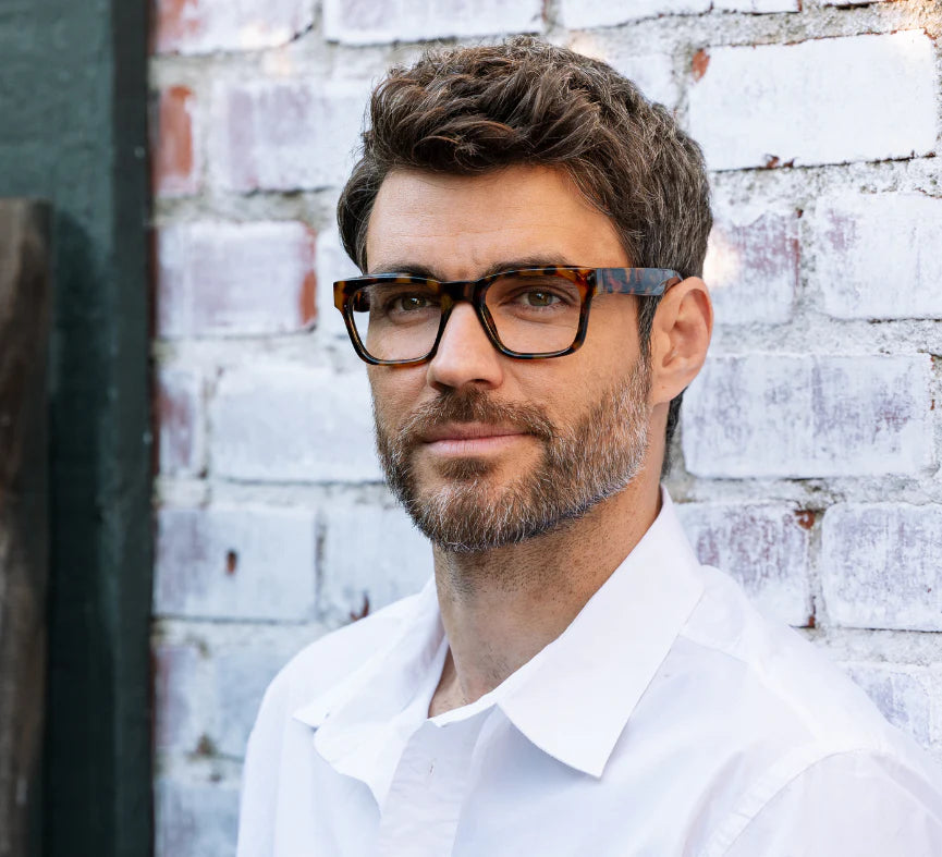 Peepers Boon Blue Light Reading Glasses in Tortoise featuring bold square frames with warm amber tones and lightweight construction.