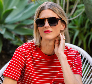 Woman wearing Peepers Deep Dive Polarized Sunglasses in Mocha Tortoise featuring a modern square aviator frame with polarized UV400 lenses.