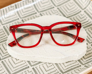 Peepers Lenora Blue Light Reading Glasses in Red and Fire Tortoise featuring a vintage-inspired soft square frame, gold pin accents, and lightweight polycarbonate construction.