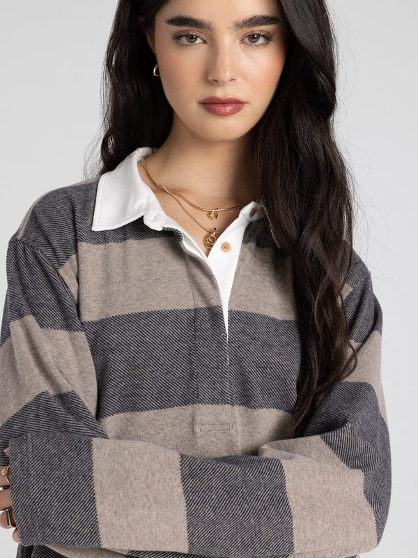 → Pierce Top — close-up of collared neckline and hidden quarter-button closure