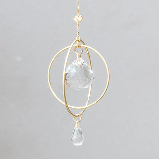 Scout Curated Wears Lotus Strength mini crystal suncatcher featuring gold-plated brass design and crystal prisms creating rainbow reflections