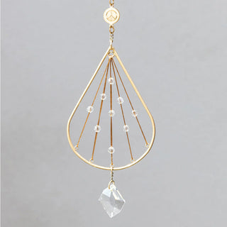 Scout Curated Wears Peace Tranquility mini crystal suncatcher featuring gold-plated brass design with crystal prism and rainbow reflections