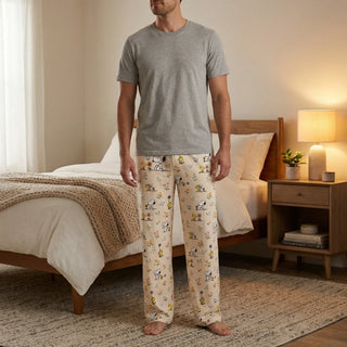 Man wearing Snoopy and Woodstock floral cottage core lounge pants with lightweight relaxed fit and drawstring waist