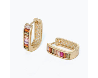 Gold huggie hoop earrings featuring rectangular crystals in soft muted shades of pink, mauve, amber, and olive.