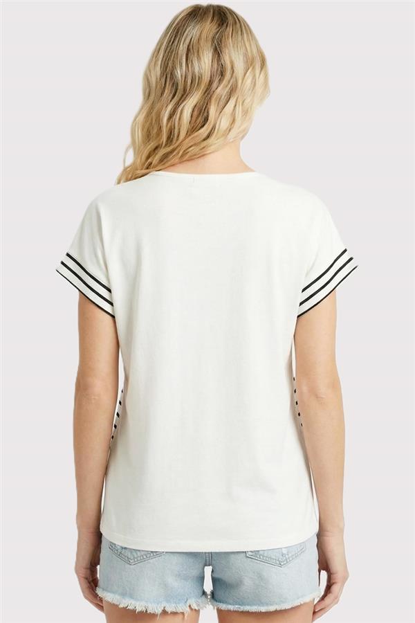 Back view of woman wearing ivory and black striped short sleeve split neck jersey knit top with denim shorts
