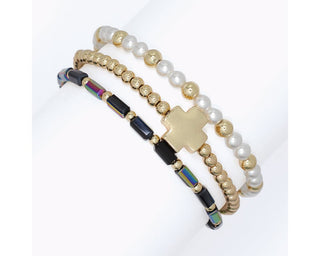 3-strand stretch bracelet set with faux pearl beads, gold beads with cross charm, and faceted AB black beads by Periwinkle — a stunning stacking bracelet set
