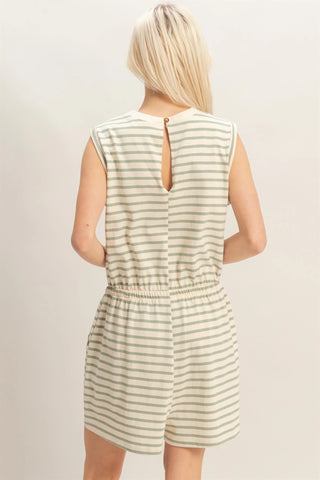 woman wearing sage striped sleeveless romper with drawstring waist and pockets back view