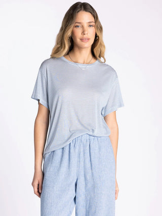 Woman wearing the Thread & Supply Opalite relaxed fit striped cotton crew neck tee in a soft blue stripe with lightweight short sleeves.