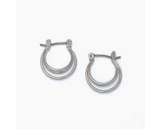 Delicate triple-ring polished silver huggie hoop earrings with latch-back closure by Periwinkle — small minimalist silver hoops perfect for everyday wear and stacking
