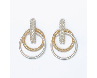 Two-tone textured drop earrings featuring layered gold-tone and silver-tone circular rings in a modern mixed-metal design.