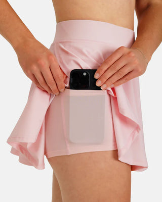 Women’s blush tiered flare athletic skort by Waggle with built-in compression shorts