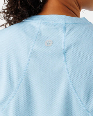 Women’s blue short sleeve performance athletic shirt by Waggle with lightweight breathable fit