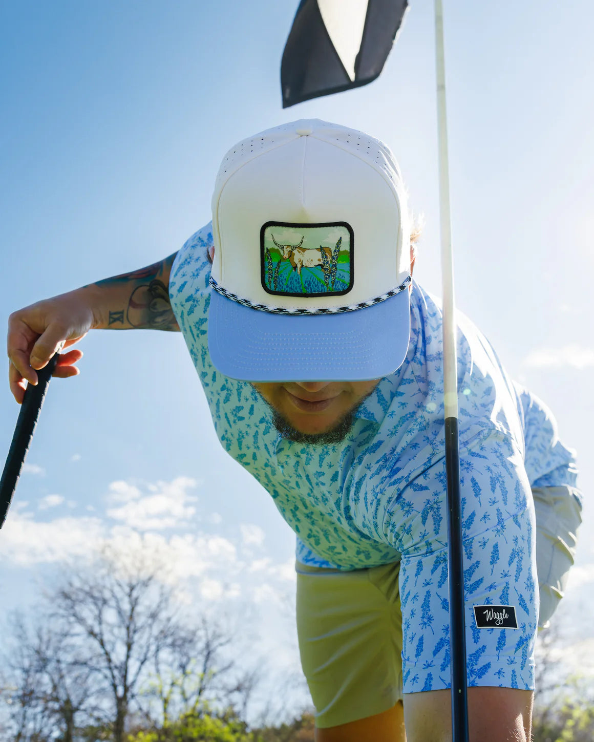 Man wearing Waggle Hill Country snapback hat with western steer and bluebonnet patch