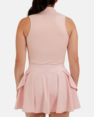 Women’s blush sleeveless mock neck athletic golf top by Waggle with zip neckline and performance fit