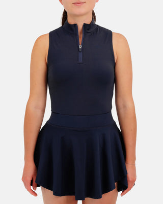 Women’s navy sleeveless mock neck athletic golf top by Waggle with zip neckline and performance fit