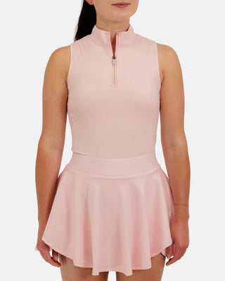 Women’s sleeveless mock neck athletic top by Waggle with zip neckline and performance fit