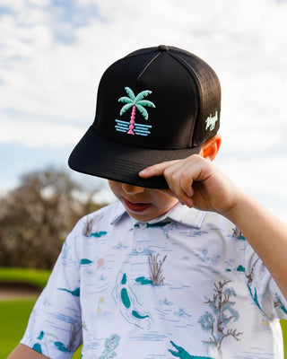 Kid wearing Waggle South Beach youth hat outdoors