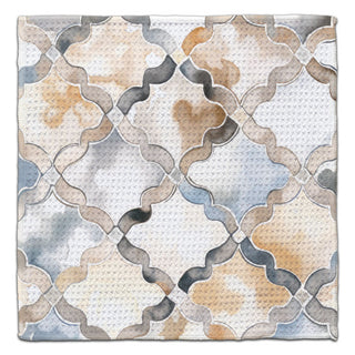 Eco-friendly waffle weave washcloth featuring a watercolor wavy lattice pattern in gray, blue, beige, and cream.