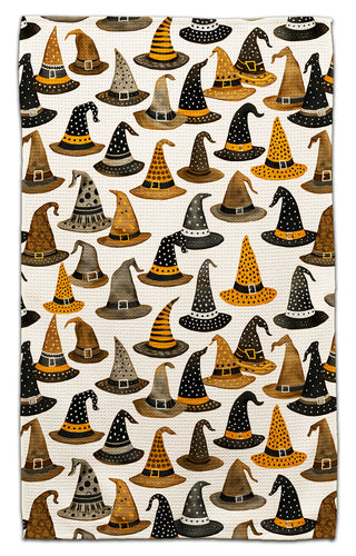 Halloween kitchen towel with whimsical witch hats in black, gold, gray and orange on a white background