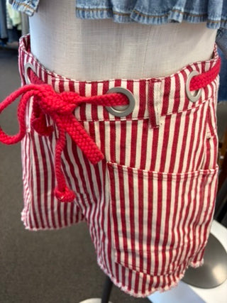 Red and white striped shorts with a rope tie on a mannequin.