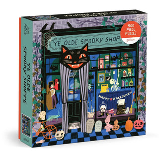 Galison Ye Olde Spooky Shoppe 500-piece Halloween puzzle featuring a whimsical vintage spooky shop with a black cat, skeleton, pumpkins, ravens, bats, and magical curiosities by artist Anne Bentley.