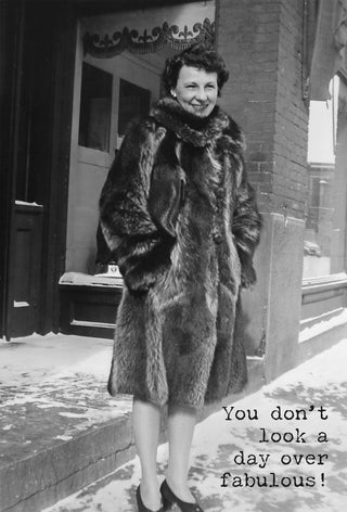 Vintage black and white birthday card with woman in fur coat and the message You Don't Look a Day Over Fabulous